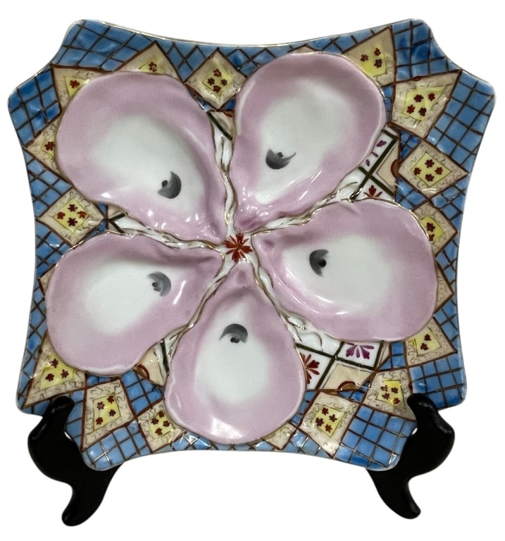 ANTIQUE PORCELAIN OYSTER SERVER PLATTER 8.5": Charming antique majolica oyster server featuring five molded oyster-shaped wells arranged around a central floral motif. The square tray is richly decorated with a colorful geometric mosaic border in