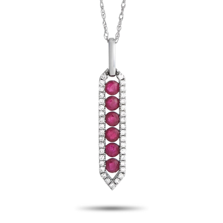 14K WHITE GOLD 0.16CT DIAMOND AND RUBY PENDANT NEC: Put on this diamond and ruby necklace and let your look sparkle with a statement. This 14K white gold piece has a 17 long cable chain with a spring ring clasp. A chic pendant with six faceted rubies s