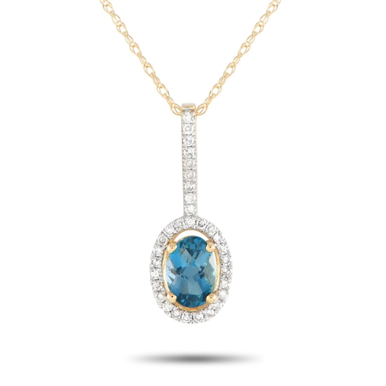 14K YELLOW GOLD 0.09CT DIAMOND AND BLUE TOPAZ PEND: Add luxury to your daily style with this diamond and blue topaz necklace. It is crafted in 14K yellow gold, with a double cable chain measuring 18 inches long. The bail shimmers with petite round diam