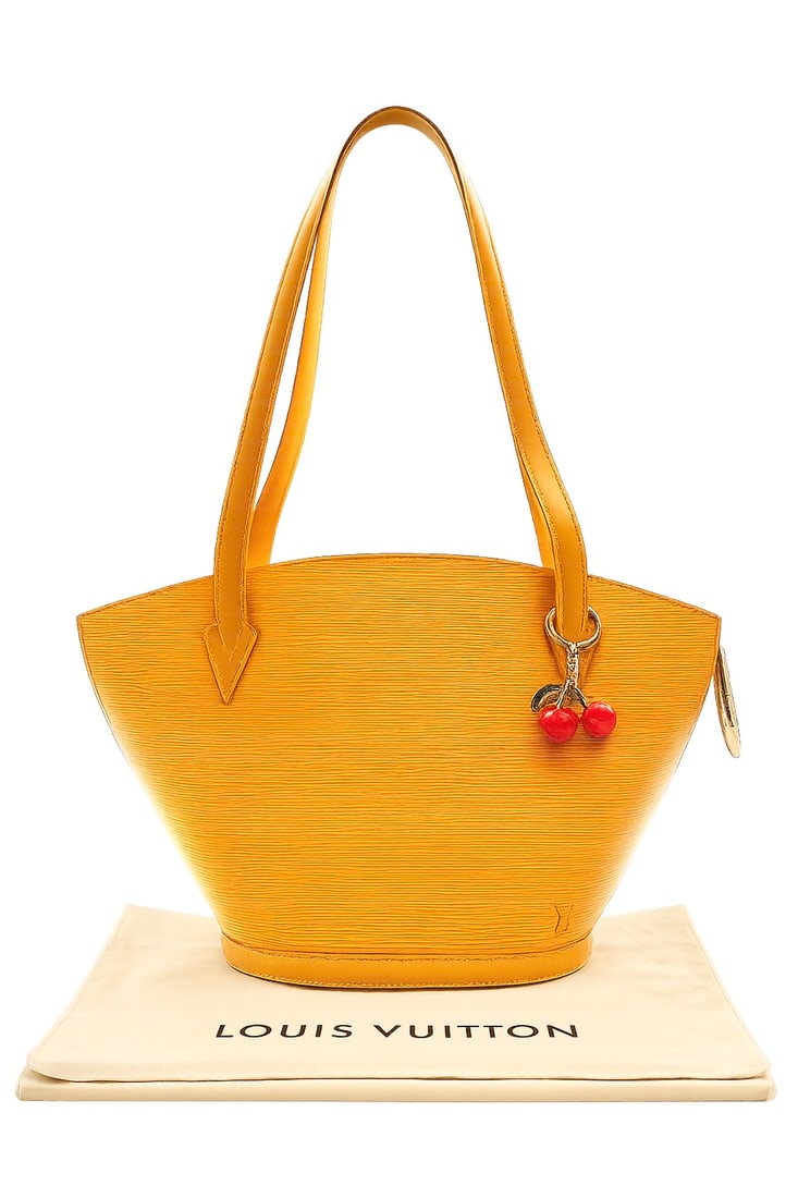 LOUIS VUITTON YELLOW EPI SAINT JACQUES PM 17?: This Louis Vuitton Saint Jacques PM tote is crafted in vibrant yellow Epi leather and features the iconic embossed LV logo, long shoulder straps, silver-tone hardware, and a top zip closure. The struc