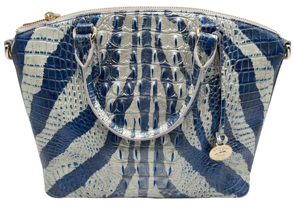 BRAHMIN DUXBURY DAZZLE BLUE CROC LEATHER BAG 11": This Brahmin handbag features the brand?s signature embossed crocodile-print leather in an eye-catching blue and white pattern. The structured silhouette is accented with dual rolled handles, silver-t