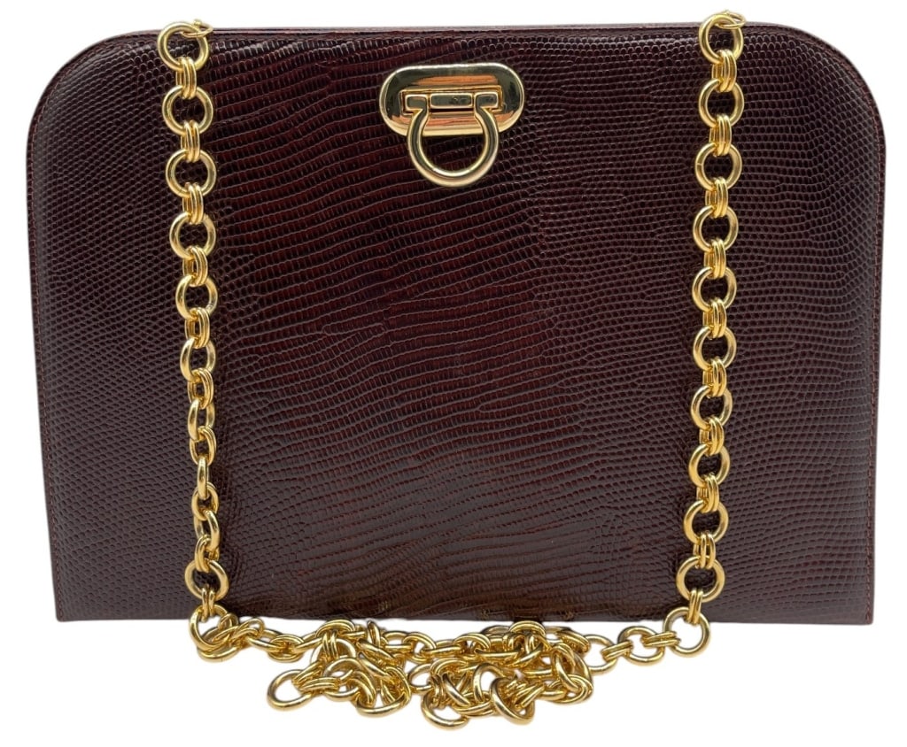 SALVATORE FERRAGAMO ESQUE LIZARD CHAIN BAG 11": This vintage Salvatore Ferragamo handbag features a rich dark brown lizard-embossed leather exterior complemented by polished gold-tone hardware and a classic chain shoulder strap. The front is adorne