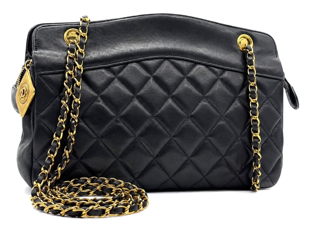 CHANEL QUILTED LAMBSKIN SHOULDER BAG 12": Classic vintage Chanel shoulder bag crafted in supple black quilted lambskin leather with elegant gold-tone hardware and leather-woven chain straps. This timeless design features Chanel's signature di