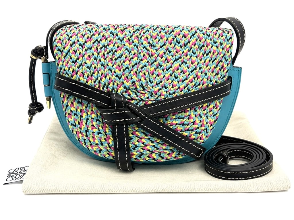 LOEWE WOVEN GATE CROSSBODY BAG 11": Loewe Gate crossbody bag crafted in Spain featuring a vibrant multicolor woven front panel accented with supple turquoise blue leather trim and black leather contrast straps. The signature Loewe knott