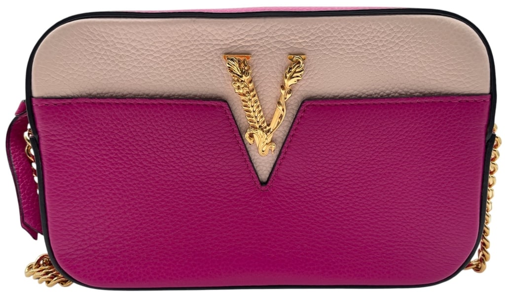VERSACE VIRTUS PINK CROSSBODY BAG 9": Versace Virtus crossbody bag crafted in grained leather with a two-tone pink colorway featuring a blush upper panel and vibrant pink lower panel. The front is accented with the signature gold-tone Vir