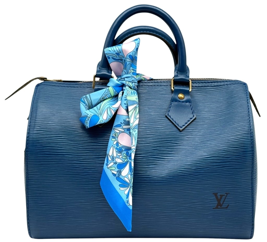 LOUIS VUITTON BLUE EPI LEATHER SPEEDY 25 BAG: Louis Vuitton Speedy 25 handbag crafted in blue Epi leather with rolled leather handles and gold-tone hardware. Features the classic structured silhouette, top zip closure, and embossed LV logo on the