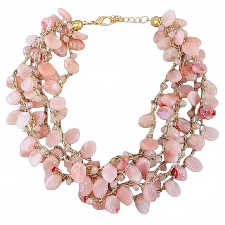 Multi-Strand Pink Quartz Statement Necklace: Elegant statement necklace featuring multiple strands of polished pink quartz beads with gold-tone metal findings and lobster clasp. Versatile piece adding a touch of sophistication to any outfit, as 