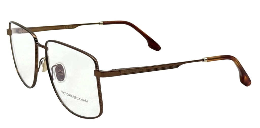 VICTORIA BECKHAM VB2136 SQUARE EYEGLASSES SET: Victoria Beckham VB2136 eyeglass frames in a bronze-tone metal finish with oversized square lenses and tortoise-pattern temple tips. The frames are marked VB2136 730, size 56.15-140, and made in Italy