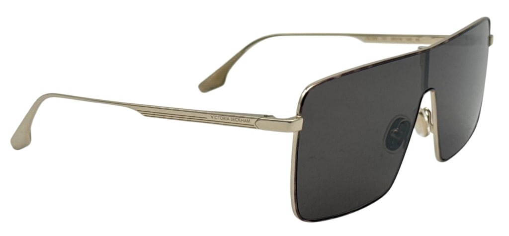 VICTORIA BECKHAM VB238S SHIELD SUNGLASSES SET: Victoria Beckham VB238S shield-style sunglasses featuring a gold-tone metal frame with a single dark tinted lens. Marked model VB238S 701, size 58.19-140, and made in Italy. Includes Victoria Beckham 
