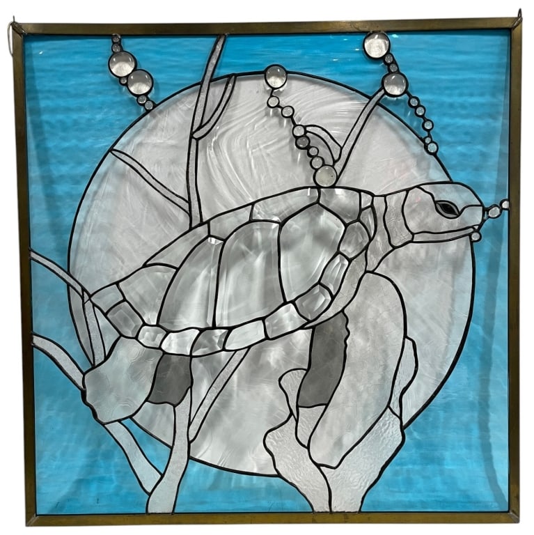 STAINED GLASS SEA TURTLE PANEL SIGNED 33in: Handcrafted stained glass panel depicting a sea turtle swimming among underwater foliage against a vibrant blue ocean background. The design incorporates opalescent and textured glass in shades of blu