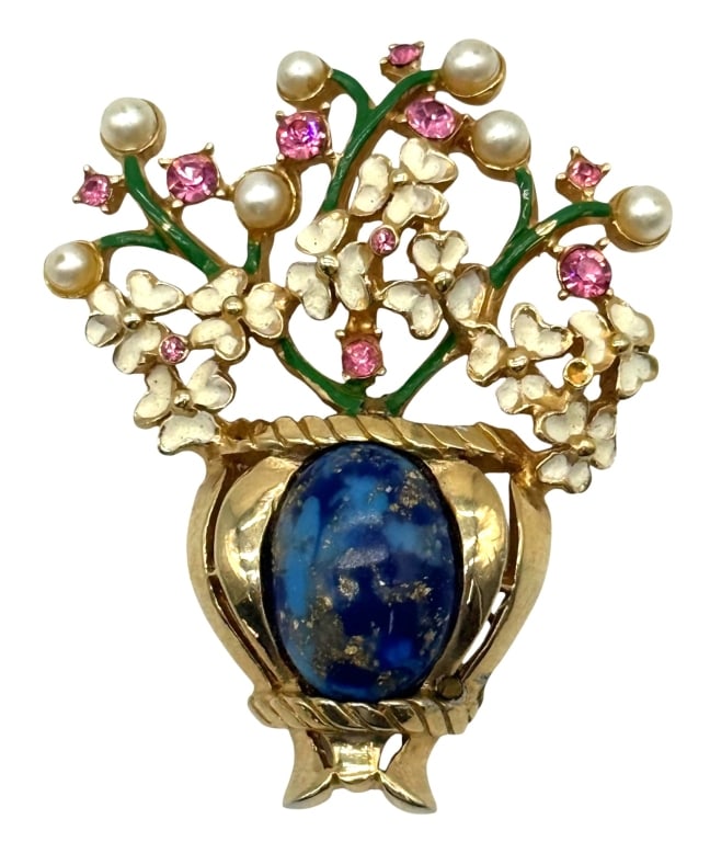 KRAMER FOR DIOR VINTAGE LAPIS FLORAL BROOCH: Vintage Kramer for Dior costume jewelry brooch dating to the 1950s?1960s, featuring a large oval faux lapis cabochon in a gilt-tone vase surrounded by enamel blossoms, faux pearls, green enamel stems,