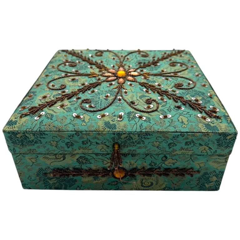 BEADED SILK JACQUARD JEWELRY BOX 8in: Vintage decorative jewelry box covered in turquoise floral brocade fabric with elaborate hand-applied beadwork, sequins, metallic thread embroidery, and faceted rhinestone accents forming an ornate fl