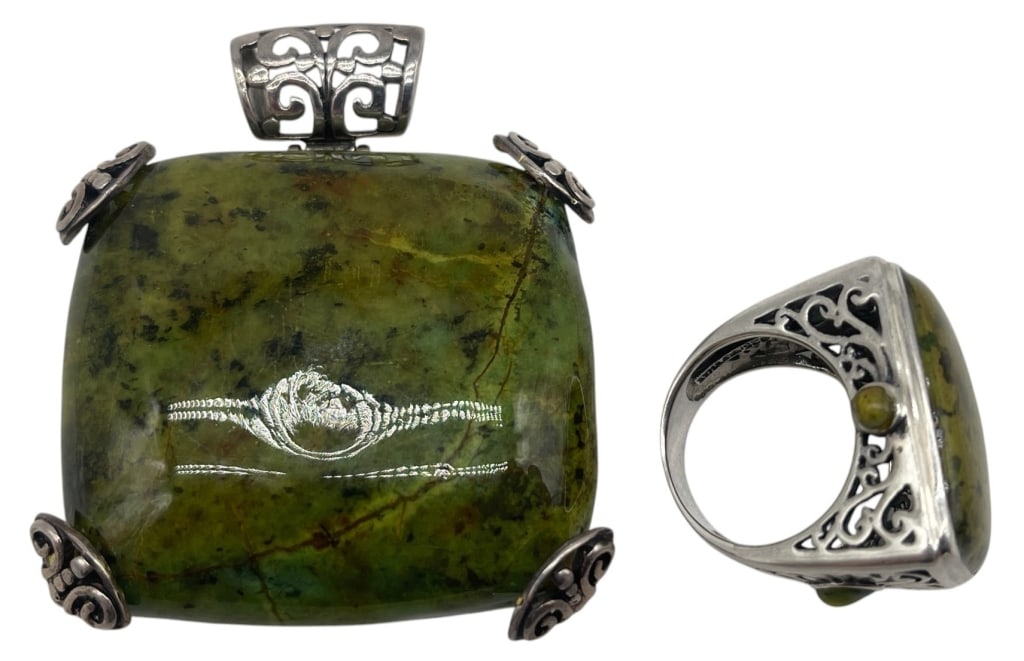 LOT OF 2 STERLING GREEN STONE PCS 63.6G 2in: Lot of two sterling silver jewelry pieces featuring polished green stone cabochons. The group includes a large statement pendant with an oversized rectangular green stone accented by decorative sterli