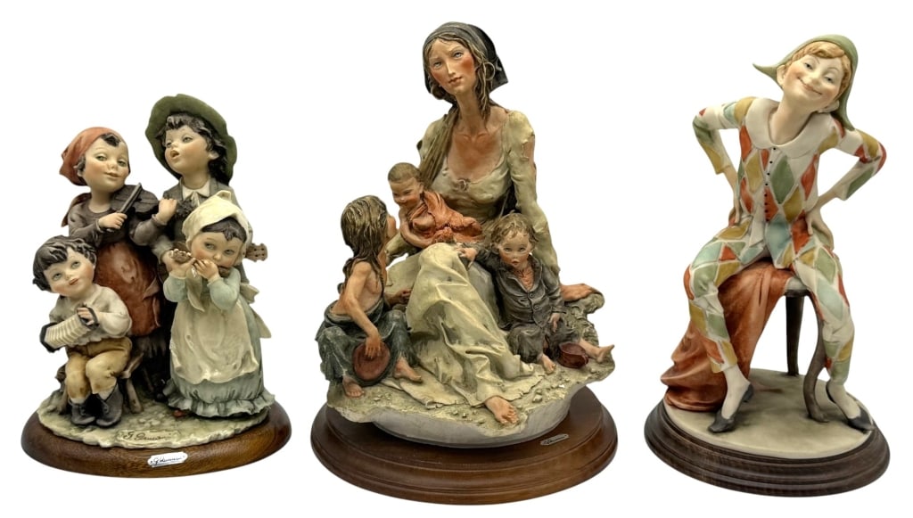 LOT OF THREE GIUSEPPE ARMANI FIGURINES: Collection of three Giuseppe Armani hand-painted porcelain figurines, each mounted on its original wood display base. The lot includes a lively quartet of child musicians, a mother with three children