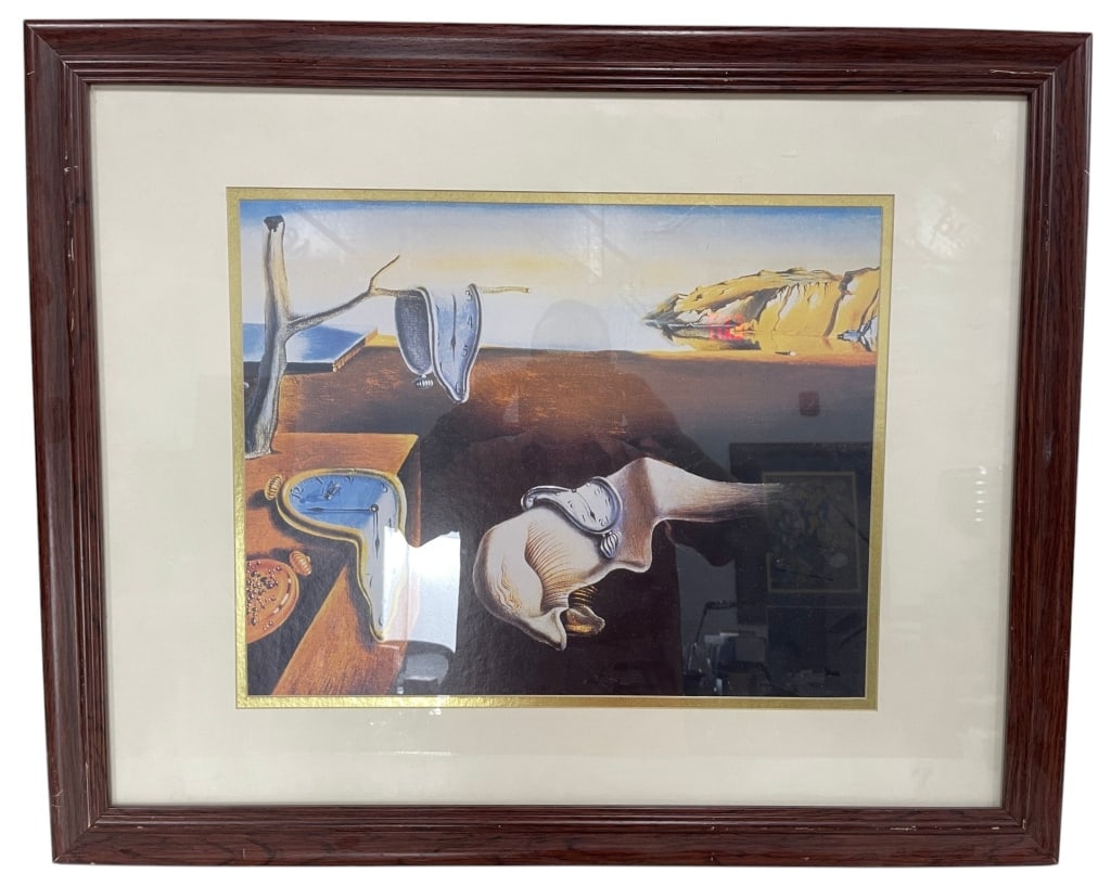 SURREALIST MELTING CLOCK PRINT AFTER DALI 31": Framed surrealist print in the style of Salvador Dal?'s iconic melting clock imagery, depicting a dreamlike coastal landscape with distorted timepieces and abstract forms. Presented under glass with a