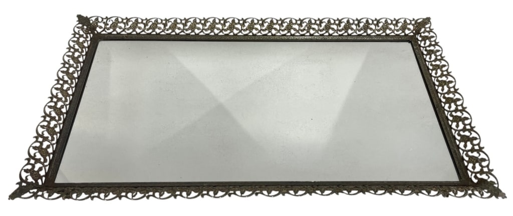 ORNATE FILIGREE METAL VANITY TRAY 18": This decorative vanity or serving tray features an elegant pierced filigree metal gallery surrounding a mirrored glass base. The intricate openwork border displays a classic Hollywood Regency and mid-