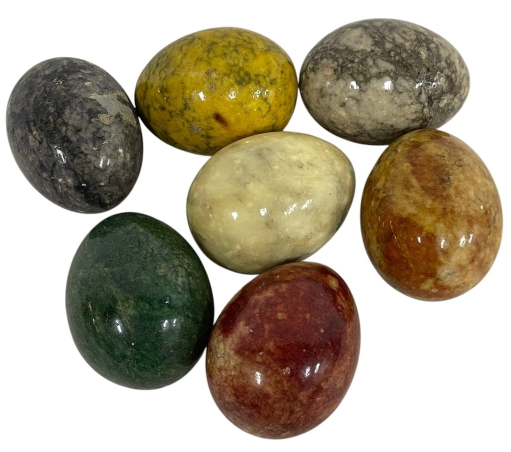 POLISHED STONE EGG COLLECTION 2": Decorative collection of seven polished stone eggs crafted from a variety of natural minerals and stones, showcasing an attractive range of colors including green, yellow, cream, gray, and reddish-bro
