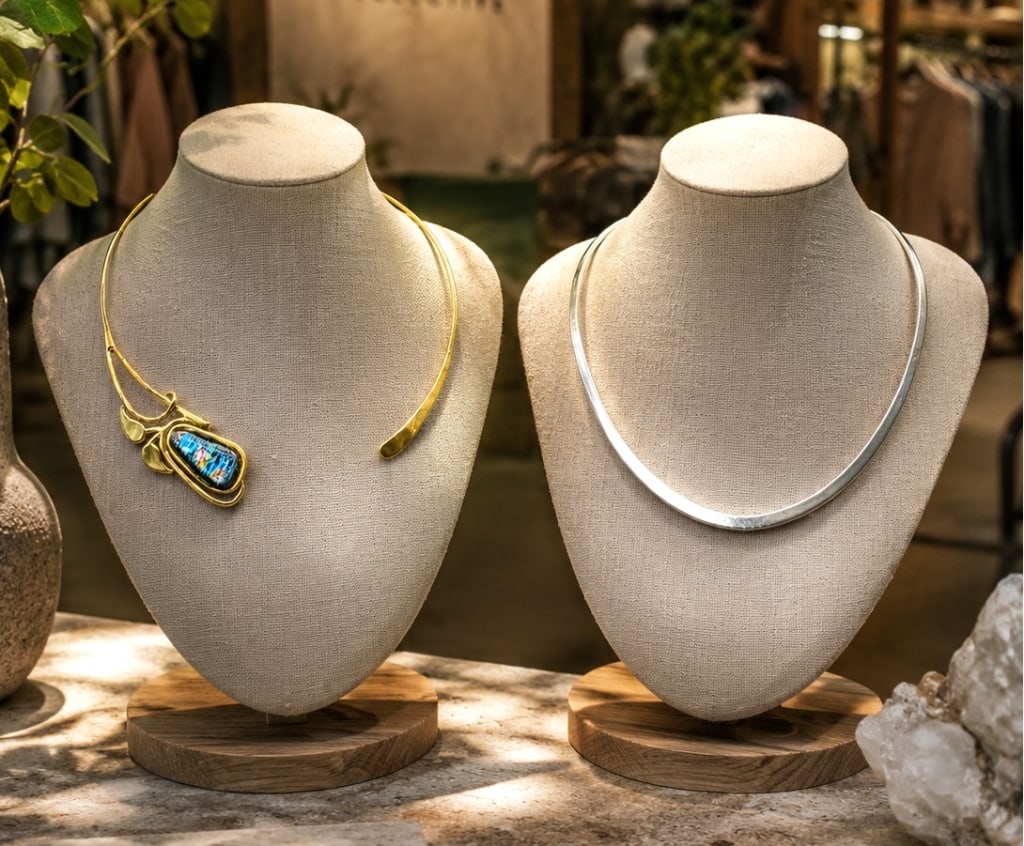WESTERN STYLE STERLING & BRASS JEWERLY 6": This lot features two distinctive artisan necklaces, each with its own modern design aesthetic. Included is a sterling silver collar necklace by Joseph Esposito, marked "925 ESPO," showcasing the desi