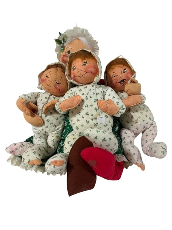 ANNALEE CHRISTMAS GRANDMA DOLL WITH THREE KIDS: AnnaLee Christmas Grandma doll with three children, all in printed pajamas. Features painted faces and soft fabric construction. Includes measuring tape reference for height. Shipping Available at www