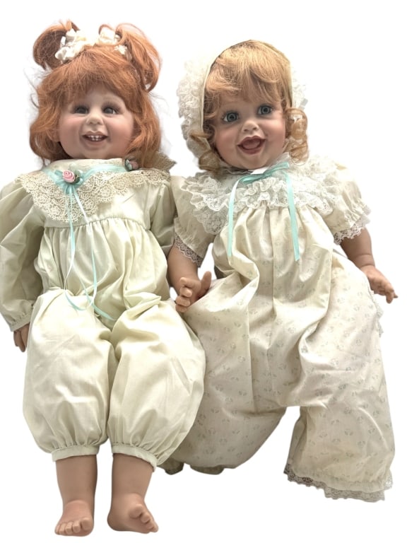 FAYZAH SPANOS REDHEAD DOLLS PAIR 21": A delightful pair of Fayzah Spanos heirloom dolls featuring expressive smiling faces, hand-painted details, and beautifully styled red-blonde hair. These charming dolls exemplify the renowned craftsma