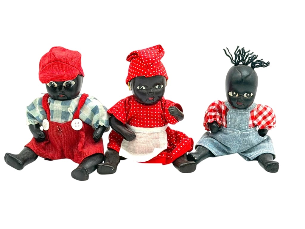 3 BLACK AMERICANA DOLL COLLECTION 5": This lot features a group of three Black-Americana dolls dressed in colorful period-inspired outfits. Crafted in the southern folk-art tradition, these small dolls showcase painted facial details, mol