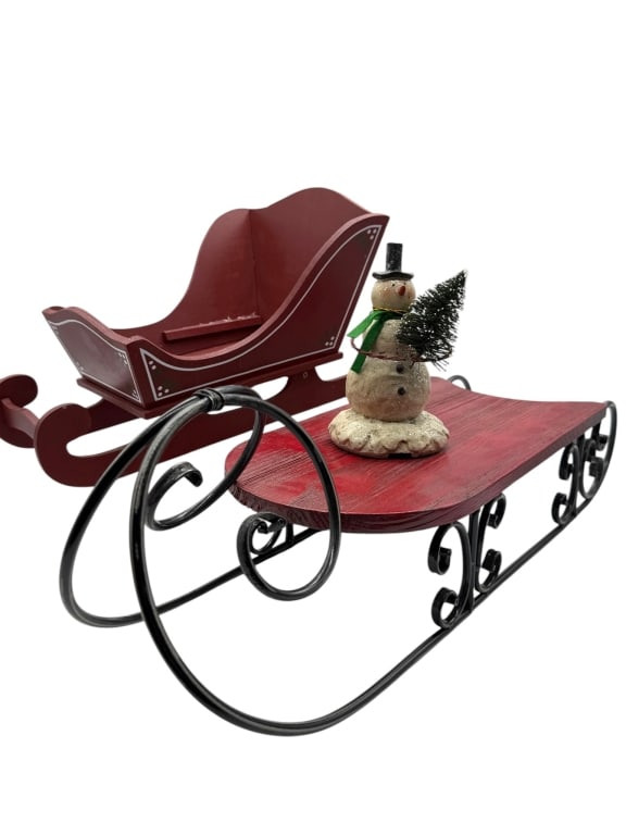 LOT OF CHRISTMAS SLEIGH DECOR & SNOWMAN FIGURE 18": Add a festive touch to your holiday decorating with this charming Christmas d?cor lot featuring a decorative red wooden sleigh, a red-painted metal sled with ornate black scrollwork runners, and a whi