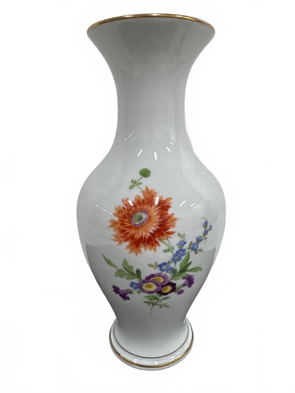 Meissen Style Porcelain Vase with Floral Motf: White porcelain vase featuring hand-painted colorful floral designs and gold rim accent. Inspired by Meissen style with crossed swords mark on base. Approx. 10" tall. Elegant, collectible decor piece 