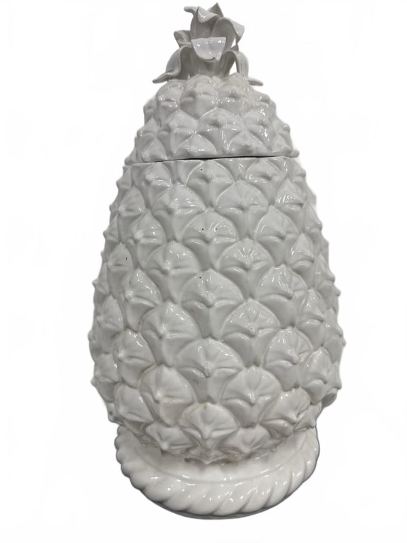 White Ceramic Pineapple Shaped Jar with Lid: This decorative white ceramic jar is uniquely shaped like a pineapple, with intricate detailing and a removable lid. The jar stands approximately 15 inches tall, making it a striking accent piece for 