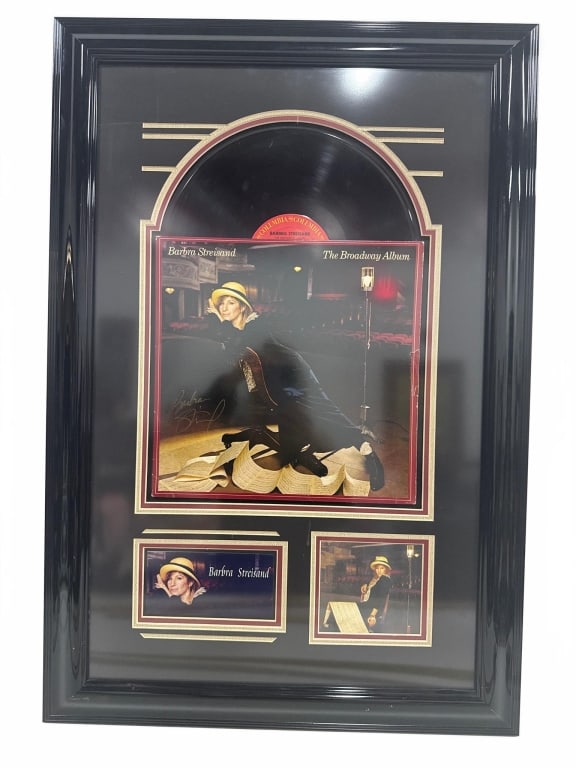BARBRA STREISAND BROADWAY ALBUM FRAMED RECORD: Framed display featuring Barbra Streisand's 'The Broadway Album' vinyl record with album cover artwork and two photo insets. Shadowbox frame measures approximately 30 inches by 19 inches. Ideal for mu