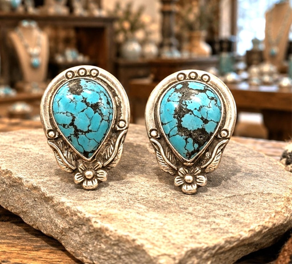 NAVAJO PRODUCED TURQUOISE EARRING SET 1": Beautiful pair of Mexican sterling silver clip-on earrings featuring polished oval malachite cabochons with striking natural green banding. Each stone is bezel set in a clean, modern sterling silver m
