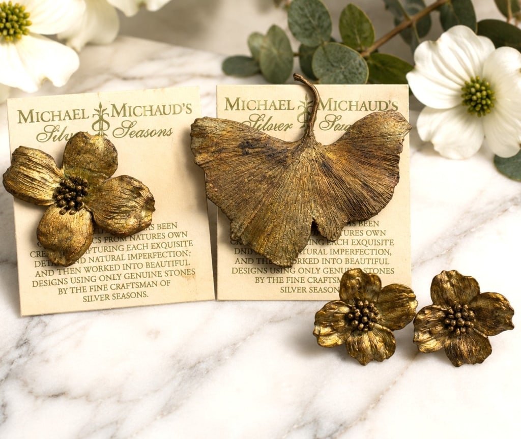 MICHAEL MICHAUD FLORAL JEWELRY LOT 3": Decorative Michael Michaud "Silver Seasons" jewelry lot including a large botanical leaf brooch, a floral brooch, and a matching pair of floral clip-on earrings. These nature-inspired pieces feature t