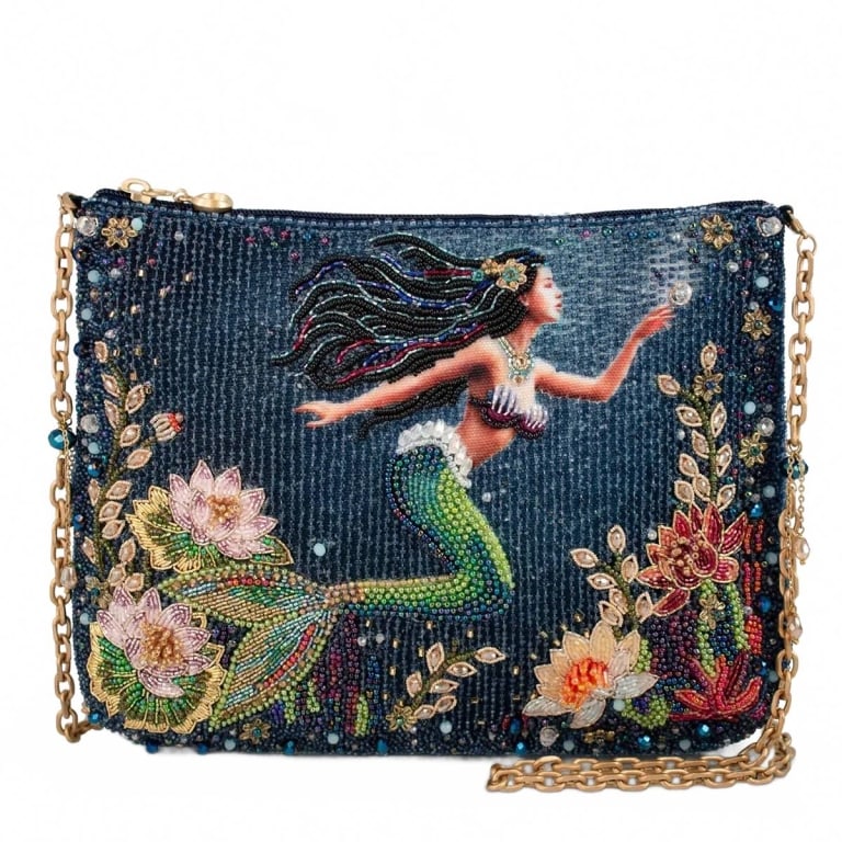 NEW MARY FRANCES MERMAID MAGIC BAG: Immerse yourself in a true piece of wearable art with this exquisitely detailed beaded crossbody. A graceful mermaid glides through richly detailed underwater florals, each bead thoughtfully placed to