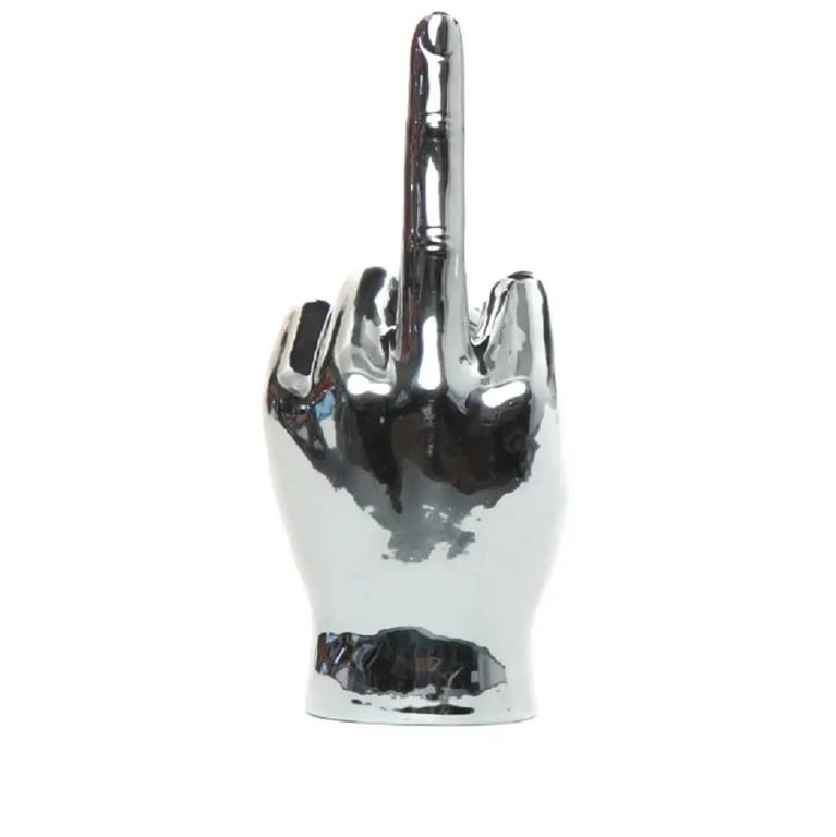 SILVER MIDDLE FINGER TABLETOP 9": The Silver Middle Finger Tabletop Hand Sculpture delivers a bold, metallic statement with its sleek, modern design and edgy attitude. Ideal for gifting or adding a rebellious touch to vibrant, contemp