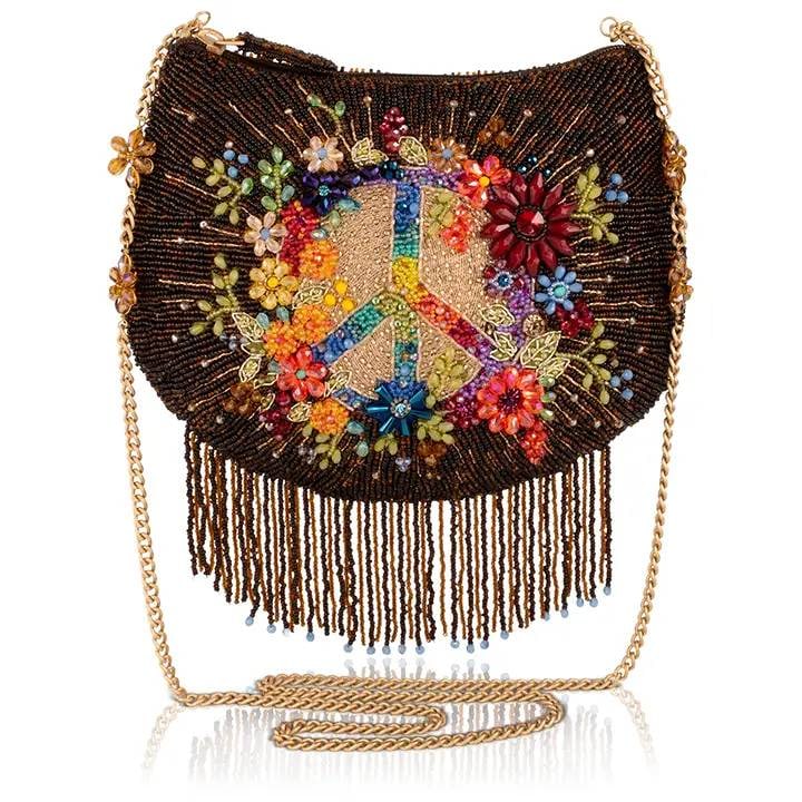 NEW MARY FRANCES PEACE AND LIGHT BAG: This bag is basically a mood board for your best self. Drenched in hand-beaded florals, a groovy peace sign, and swaying fringe that makes every step a little more fun, the Peace and Light purse is