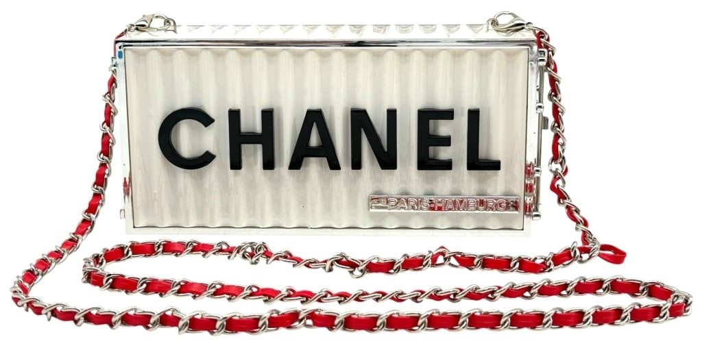CHANEL PARIS-HAMBURG WHITE ACRYLIC BOX HANDBAG: Make a bold statement with this striking CHANEL PARIS-HAMBURG Acrylic Box Chain Shoulder Bag. Featuring a sophisticated white acrylic box silhouette accented by bold black CHANEL lettering, this eye-c