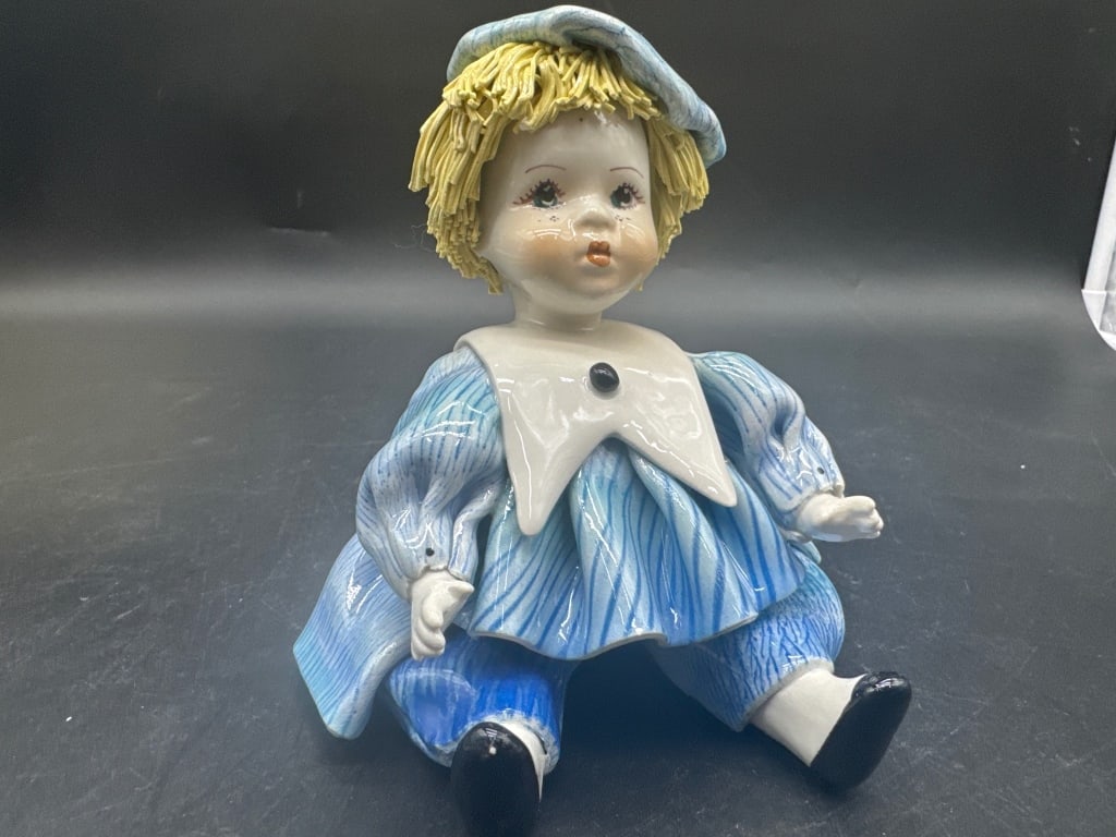 Vintage Blue Porcelain Pierrot Clown Figurine: Charming hand-painted porcelain clown doll, approx. 7 inches tall, featuring detailed blue costume and yellow hair. Features a signature on the side (Zampiva), indicating Italian craftsmanship. Excell