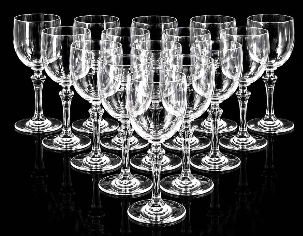 BACCARAT NORMANDIE CRYSTAL GOBLETS SET OF 12: An elegant set of twelve authentic Baccarat crystal goblets in the timeless Normandie pattern. Crafted in France, these beautifully proportioned stemmed glasses feature Baccarat's signature clear crys