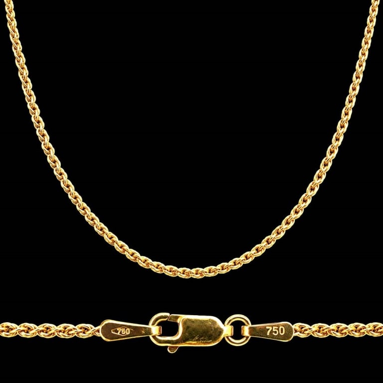 18K ITALIAN GOLD ROPE CHAIN 18": This elegant Italian rope chain is crafted in solid 18K yellow gold and features a finely woven twisted design that offers exceptional brilliance and flexibility. The necklace is stamped "750" for 18K
