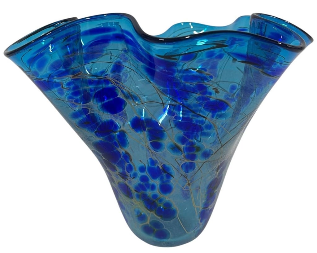 SIGNED ART GLASS FREEFORM VASE 9": This signed contemporary art glass vase features a dramatic freeform flared rim in brilliant shades of cobalt and aqua blue. The body is decorated with organic bubble-like inclusions and delicate pull