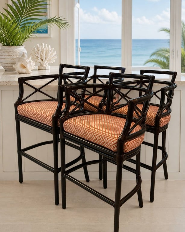 MCGUIRE RATTAN BAR STOOLS SET OF 4 44": This set of four McGuire rattan bar stools showcases the renowned craftsmanship and timeless island-inspired design for which the maker is celebrated. Each stool features a dark stained rattan frame w
