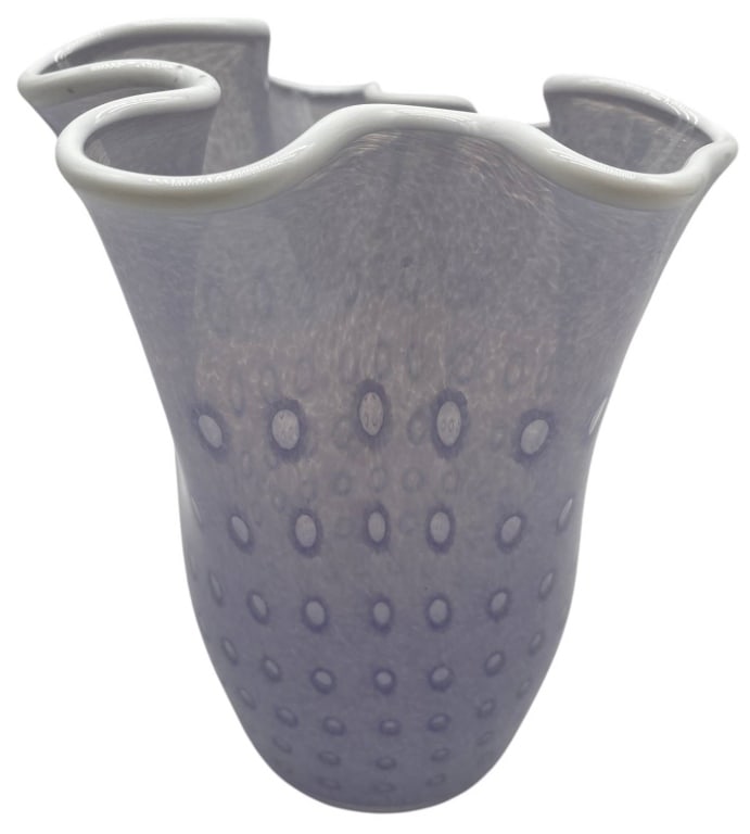 ART GLASS WAVY RUFFLED VASE 8": Hand-blown art glass vase featuring a softly tapered form with an elegant six-point ruffled rim. The body displays a delicate lavender and white mottled pattern accented by evenly spaced circular "coi