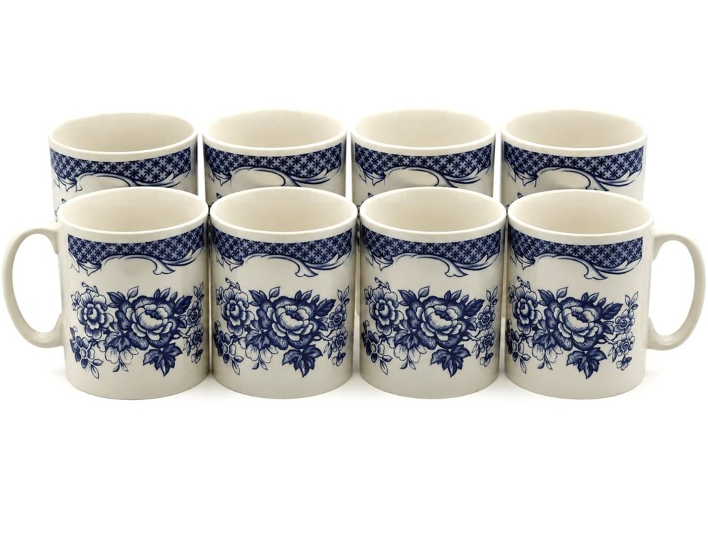 BLUE & WHITE FLORAL MUGS SET OF 8 4": This charming set of eight ceramic mugs features an elegant blue and white floral transferware design inspired by traditional English country and chinoiserie motifs. Each mug is decorated with large b