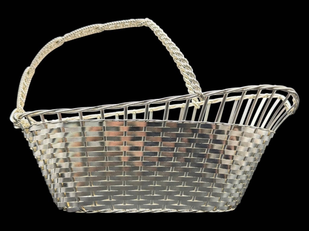 WA FRANCE SILVER PLATE WINE BASKET 10": This vintage WA France silver-plated wine basket features an elegant woven metal design with a twisted swing handle, embodying the timeless sophistication of French barware. Marked "WA France," this b