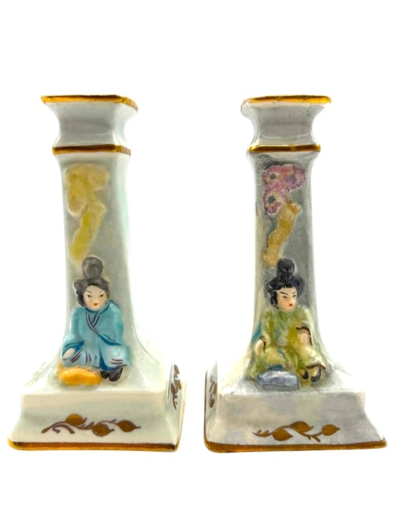 PAIR OF JAPANESE PORCELAIN FIGURAL CANDLESTICKS 6": This charming pair of vintage Japanese porcelain candlesticks features hand-painted seated geisha figures in traditional robes, accented with delicate floral relief decoration and hand-applied gilt tr