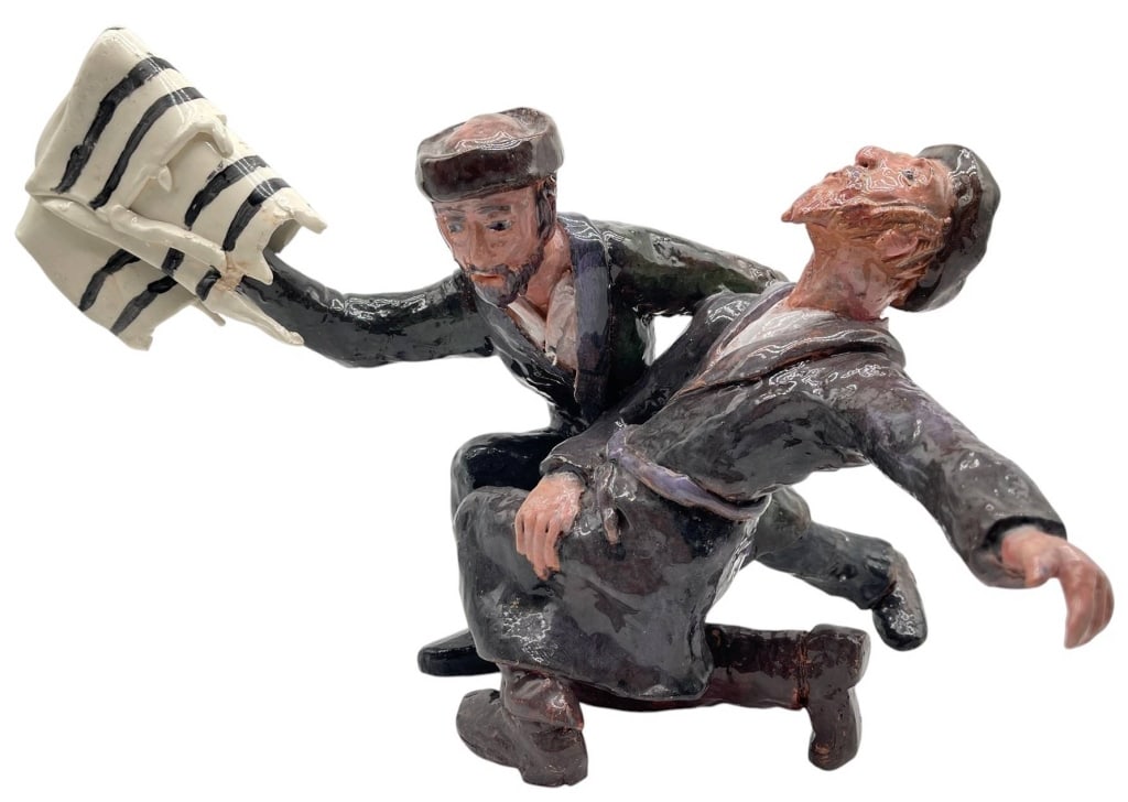 JUDAICA DANCING HASIDIC FIGURAL SCULPTURE 15": This expressive hand-painted ceramic sculpture depicts two dancing Hasidic Jewish men in traditional attire, capturing the joy and energy of a celebratory folk dance. One figure is shown holding a Tor