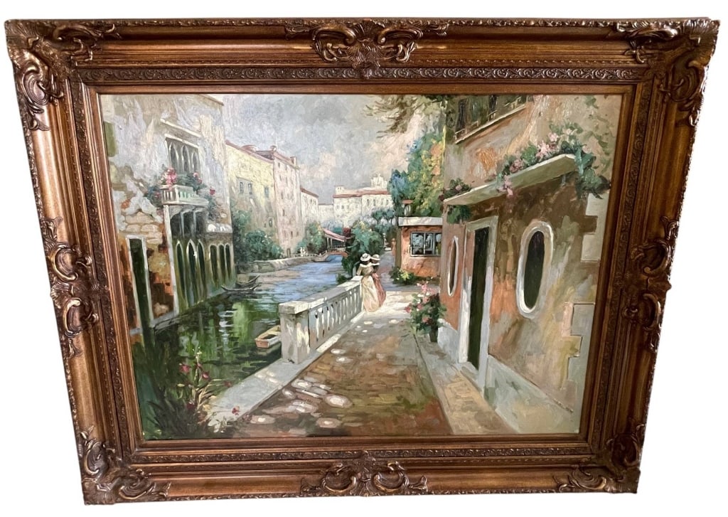 VENETIAN CANAL STREET SCENE OIL PAINTING 60": This large original oil painting depicts a romantic Venetian canal scene with figures strolling along a waterfront promenade, flanked by charming Mediterranean architecture, flowering balconies, and t