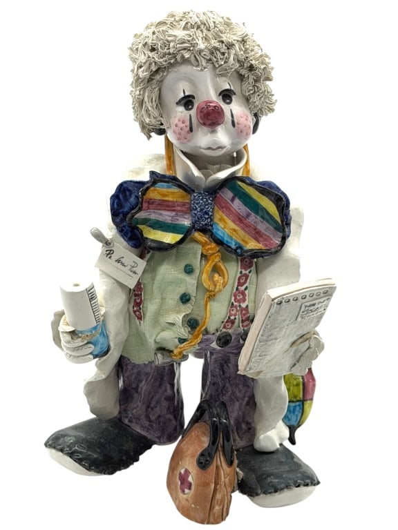 RON LEE CLOWN FIGURINE 8": Cheerful handcrafted Ron Lee porcelain clown figurine featuring the artist's signature whimsical style with expressive facial details, textured yarn-style hair, oversized rainbow bow tie, doctor's coa