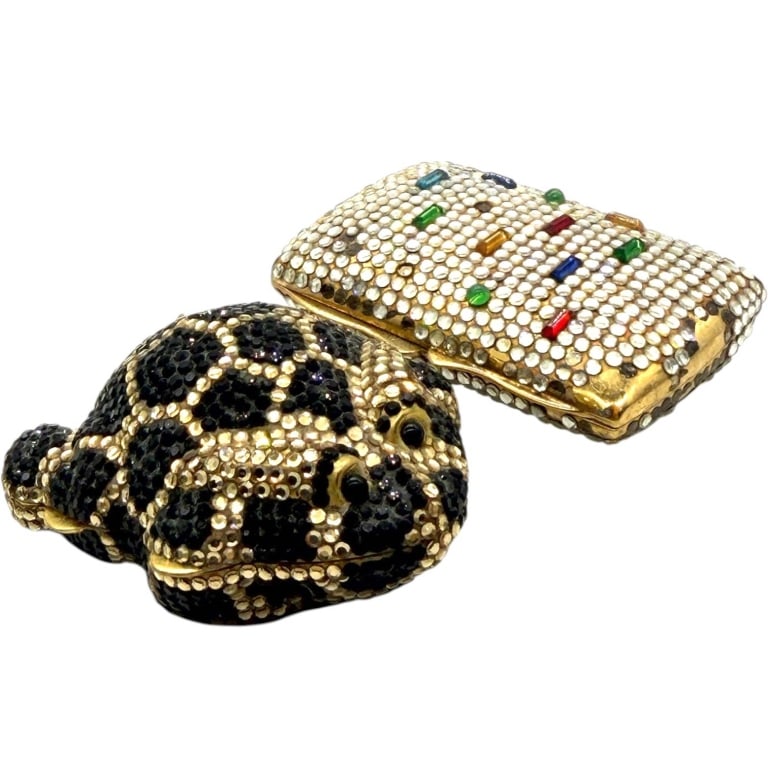 VINTAGE RHINESTONE TRINKET BOX LOT 2": This lot includes two decorative hinged trinket boxes crafted in gold-tone metal and embellished with sparkling rhinestones. One box is designed as a reclining leopard with black and clear rhinestone 