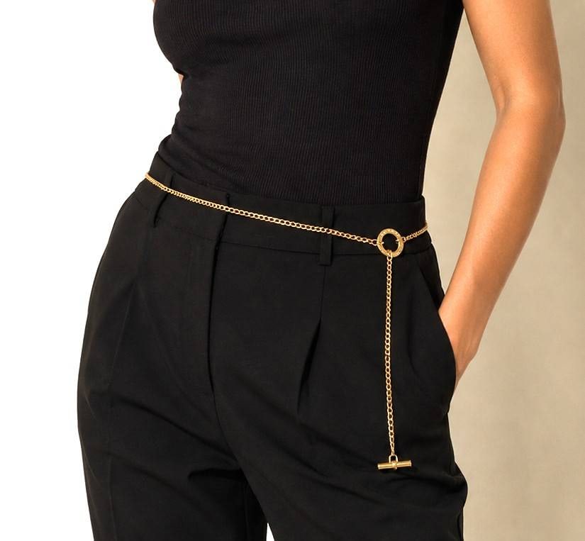 RALPH LAUREN GOLD-TONE ADJ CHAIN BELT 38": Elegant Ralph Lauren gold-tone adjustable chain belt featuring a signature engraved toggle clasp with RALPH LAUREN lettering and an RL monogram on the toggle bar. Crafted with a fine curb-link chain, 