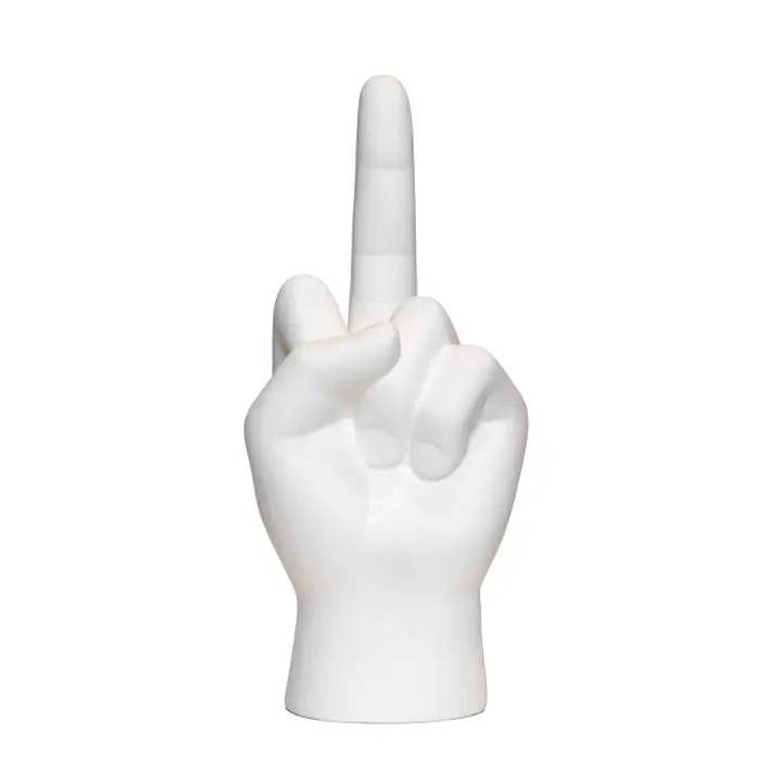 WHITE MIDDLE FINGER SCULPTURE 9": The White Tabletop Hand Sculpture features a sleek middle finger gesture, blending minimalist design with bold attitude for a standout piece in any modern or contemporary space. Ideal as a unique gift
